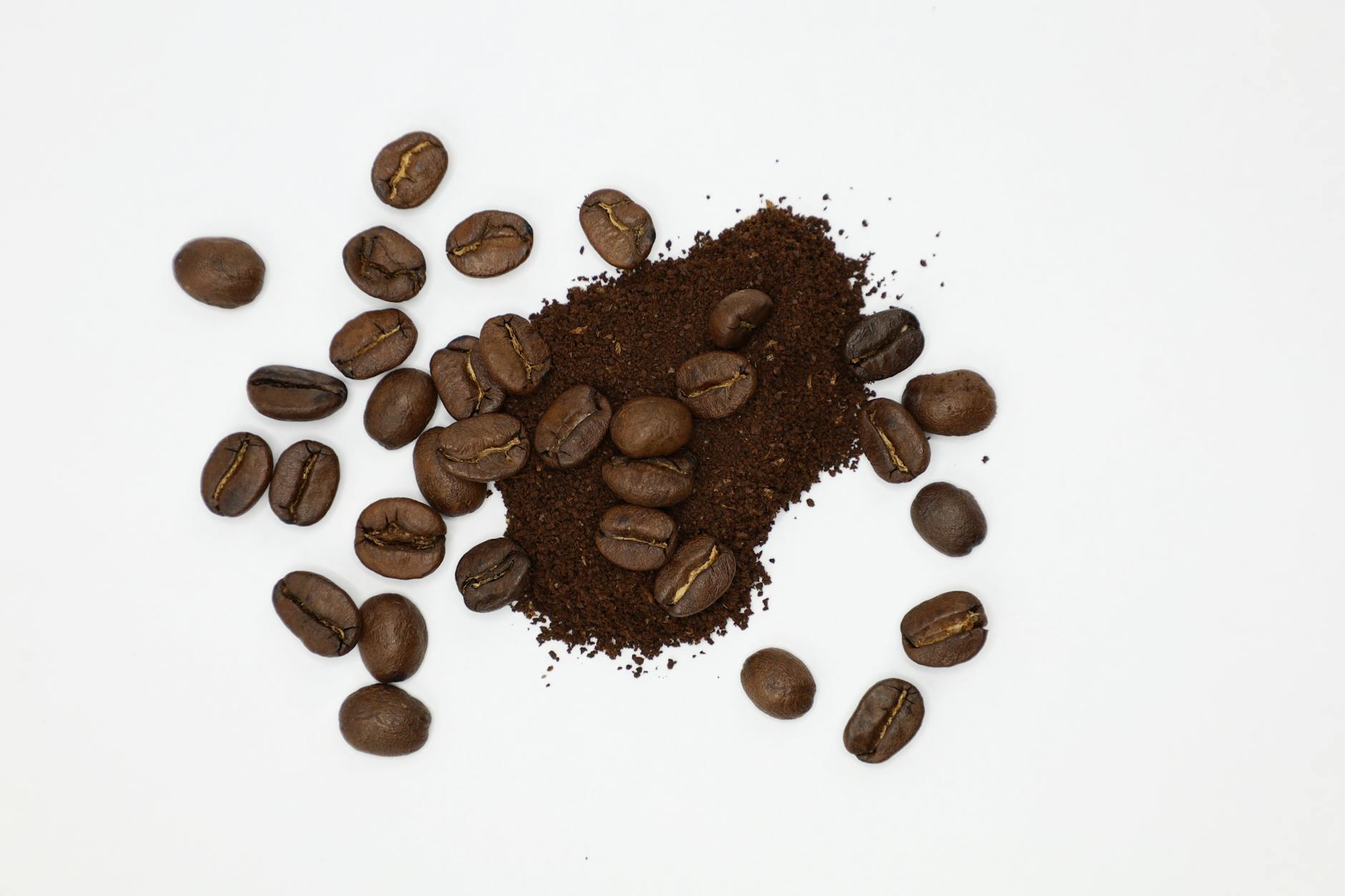 Side-by-side comparison of whole coffee beans versus ground coffee, emphasizing the increased surface area of ground coffee.