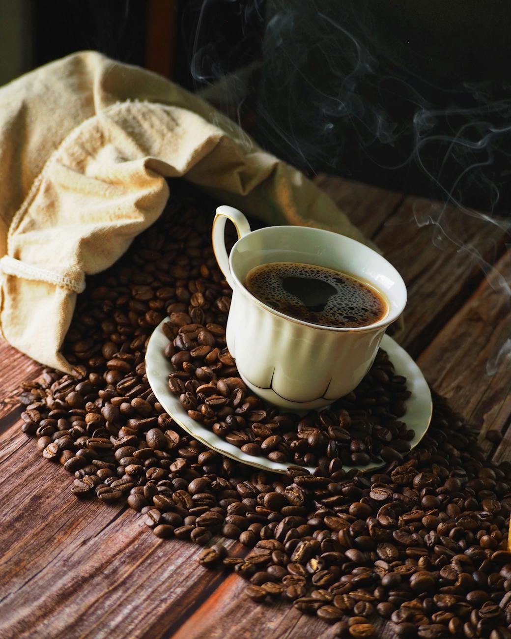 A perfectly brewed cup of coffee with steam rising, next to a premium coffee scale and a fresh bag of coffee beans, symbolizing the culmination of precise brewing, inviting and comforting, natural light, high quality